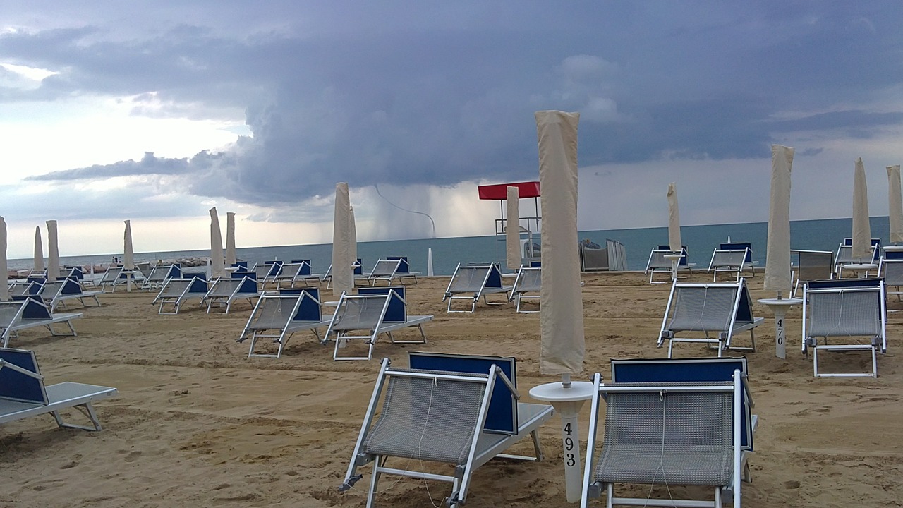 storm approaching empty beach resort